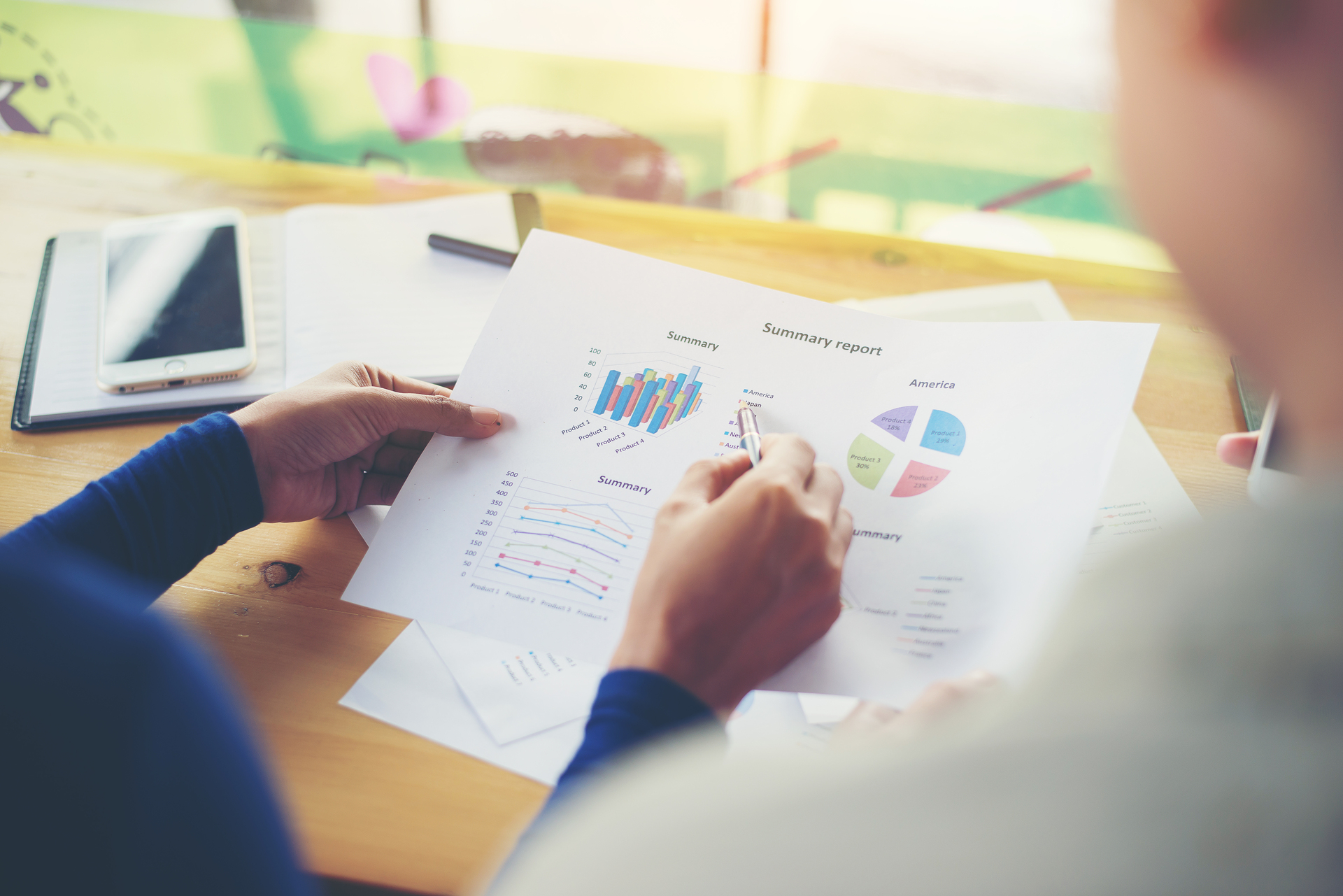 business woman hands pointing holding business graph information